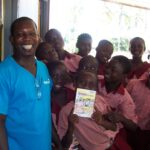 Children receive their new storybooks.